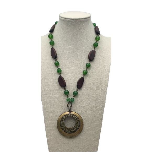 Vintage Avon SAQ Necklace Green Brown Beads Brass Medallion Pendant Boho - Picture 1 of 5
